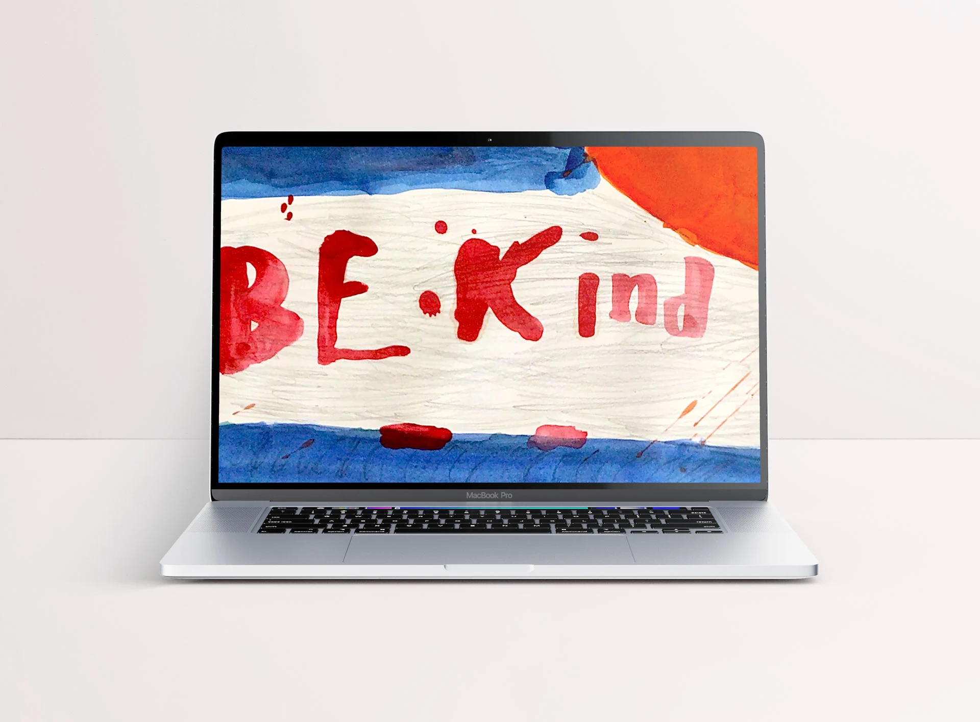 Laptop wallpaper mockup featuring a watercolor with abstract blue, brown and orange shapes and the text 'Be Kind'.