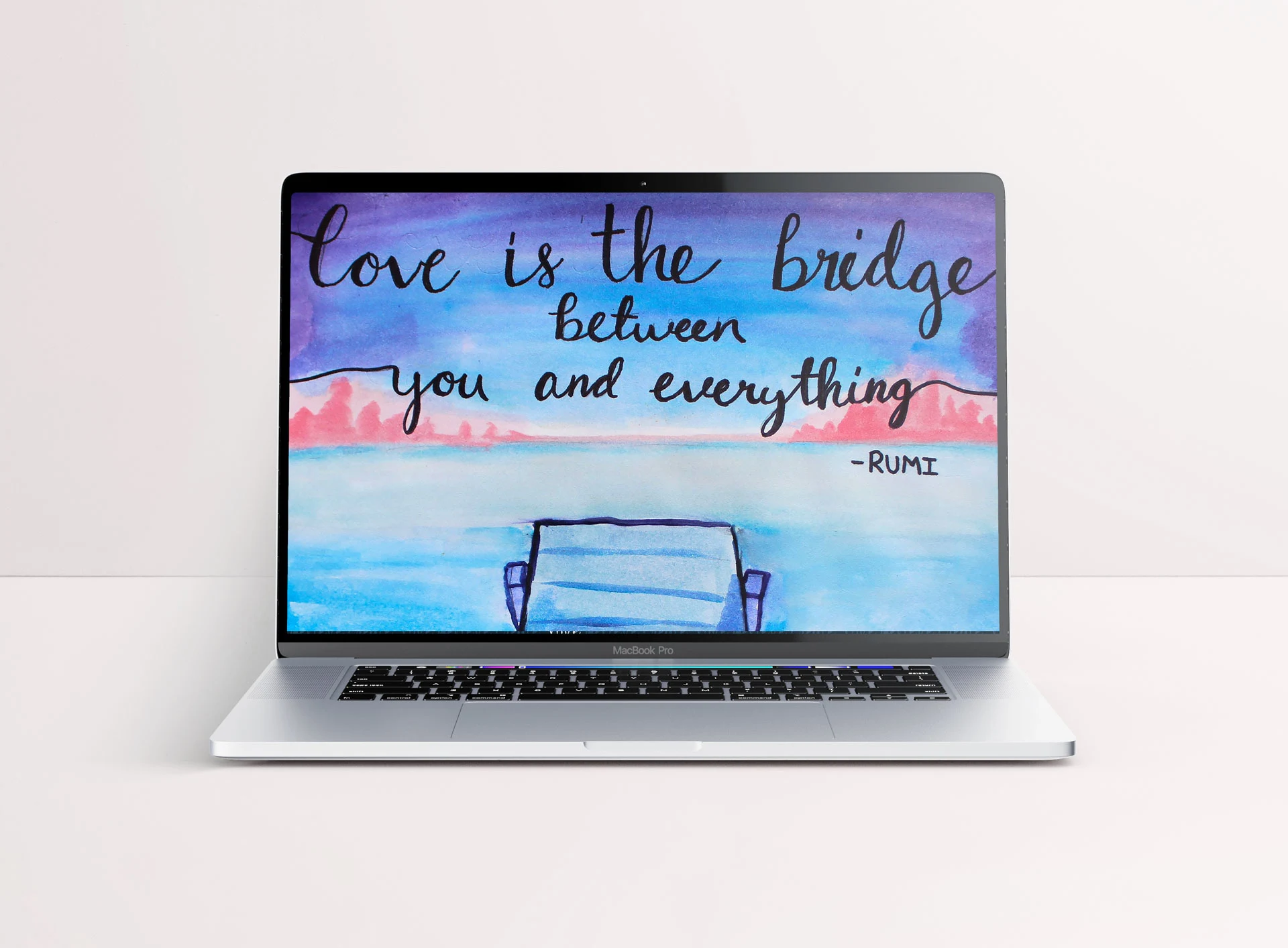 Laptop wallpaper mockup featuring a watercolor of a dock over a body of water against a blue, purple and pink sunset with a quote by Rumi.