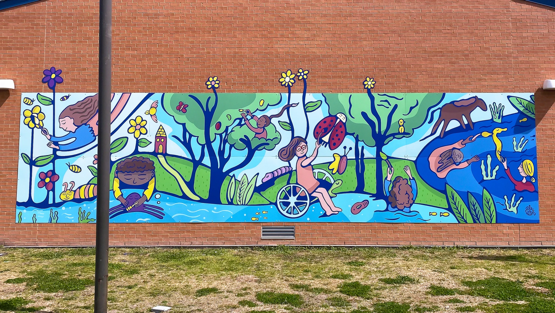 Wide shot of the completed mural installation at Burnet Elementary School