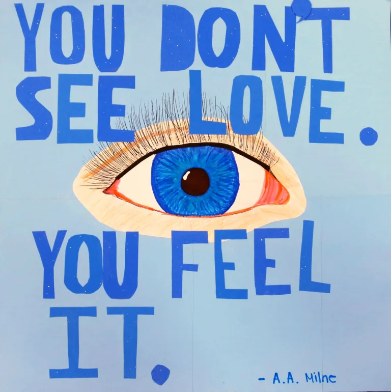 An illustration of a human eye with a bright blue iris surrounded by the quote 'You don't see love. You feel it' written cutout letters and attributed to the writer A. A. Milne.