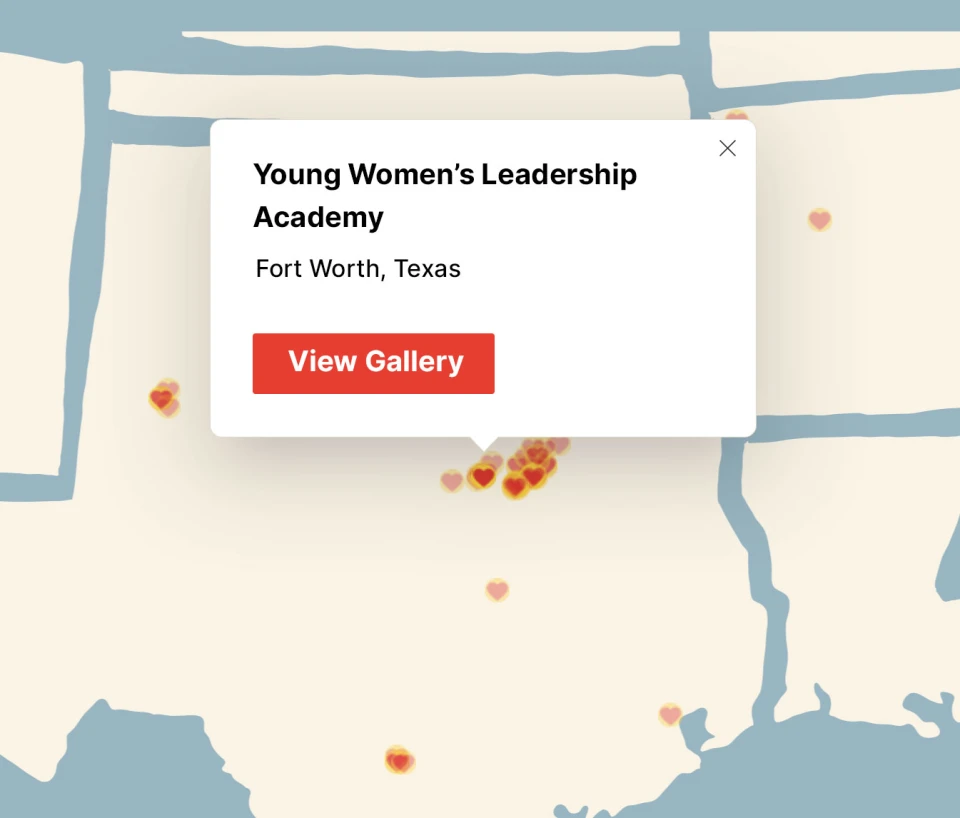 Close up of the map in the previous image showing details about a heart on the map with the text 'Young Women's Leadership Academy. Fort Worth, Texas.', along with a red button that reads, 'View Gallery.'